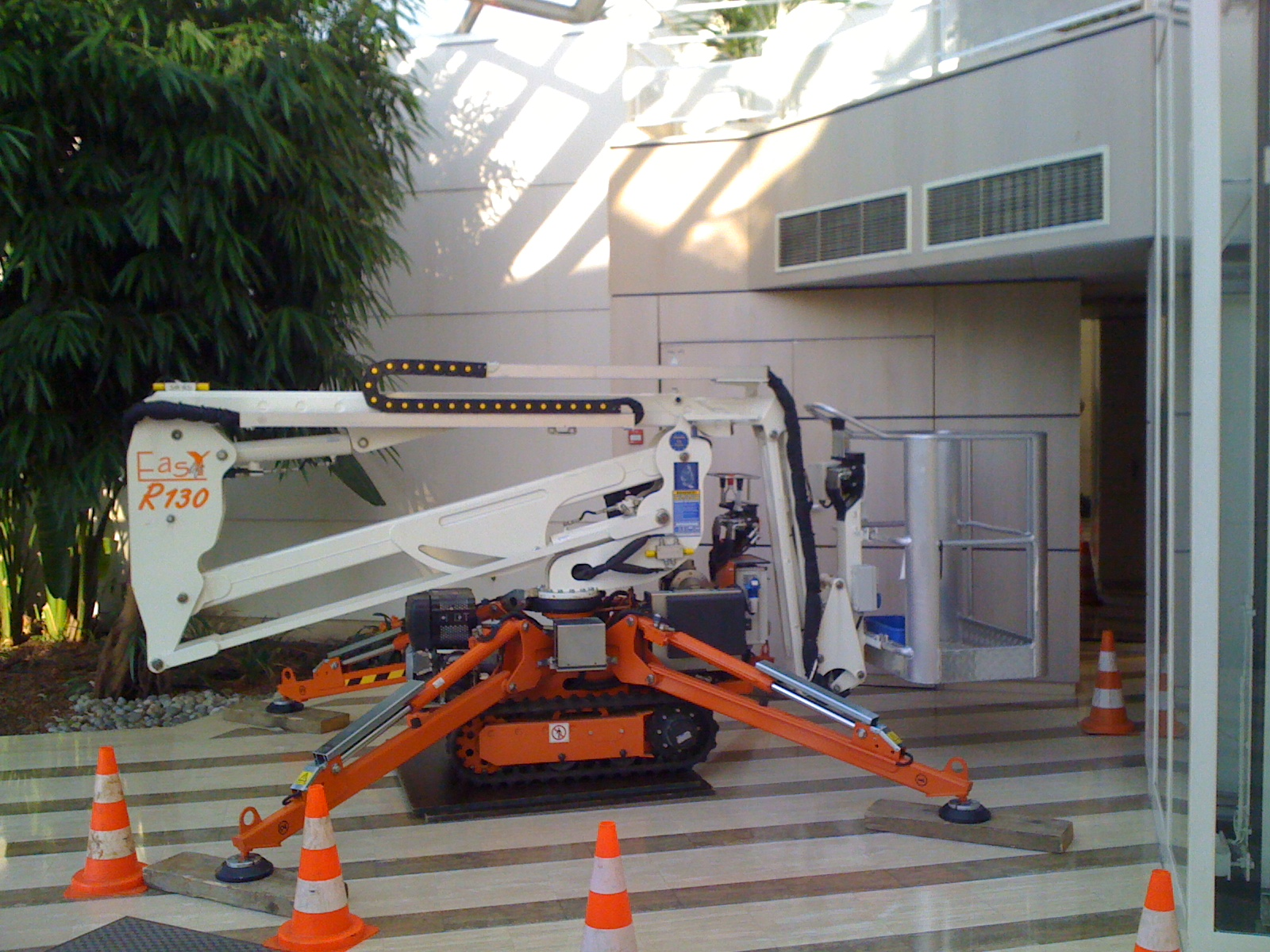 Photo of Easy Lift 40-20AJ spider lift working indoors on fragile surface